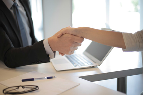 business owner and accounting consultant shaking hands