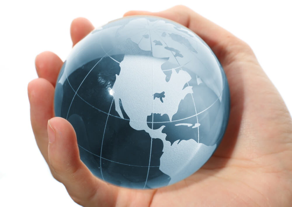 Hand holding a Globe